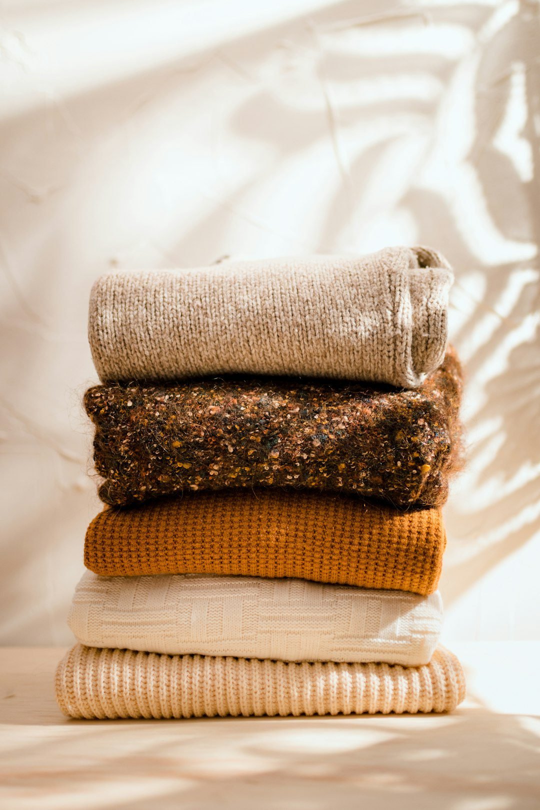 A stack of folded sweaters